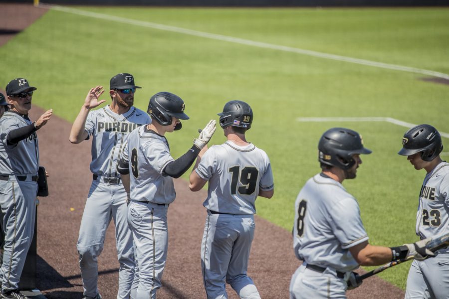 Purdue pinch runner Pat Clohisy celebrates with his team after a run during a game between Iowa and Purdue at Duane Banks Field in Iowa City, Iowa, on Saturday, May 7th, 2022. Clohisy had one run. The Boilermakers defeated the Hawkeyes, 10-6.