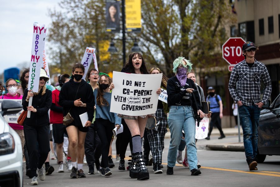 Protestors chant during a march for abortion rights in downtown Iowa City on Sunday, May 8, 2022. Around 80 people attended the demonstration.
