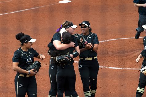 Purdue pitcher Mo Wimpee hugs her teammates during a softball game between Iowa and Purdue at Bob Pearl Field in Iowa City on Sunday, May 8, 2022. The Boilermakers defeated the Hawkeyes, 4-3. Wimpee pitched five innings and allowed three hits and one run.