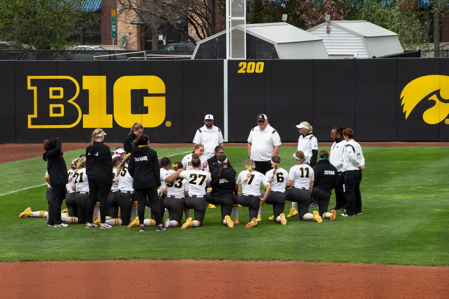 Iowa players gather around Coach Rick Dillinger after a softball game between Iowa and Purdue at Bob Pearl Field in Iowa City on Sunday, May 8, 2022. The Boilermakers defeated the Hawkeyes, 4-3. Dillinger is set to retire after the season.