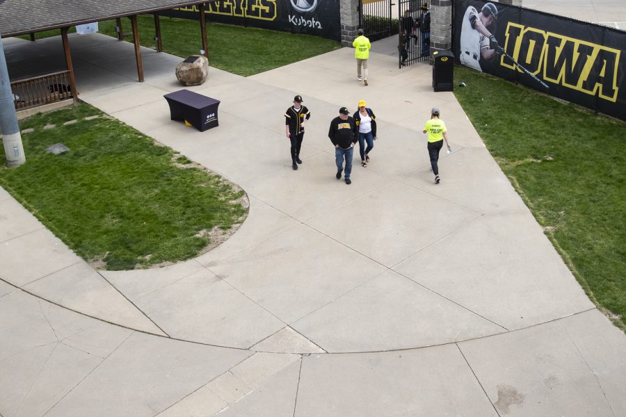 Iowa fans walk in during a baseball game between Iowa and Purdue at Duane Banks Field in Iowa City on Sunday, May 8, 2022. The Hawkeyes defeated the Boilermakers, 9-1. 