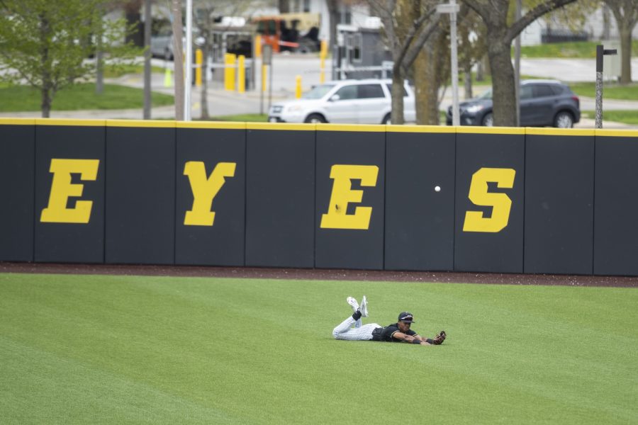 Purdue center fielder Curtis Washington misses a diving catch during a baseball game between Iowa and Purdue at Duane Banks Field in Iowa City on Sunday, May 8, 2022. The Hawkeyes defeated the Boilermakers, 9-1.