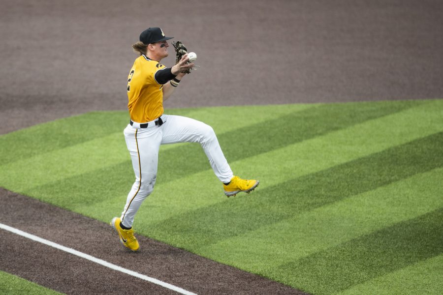 Iowa third baseman Brendan Sher fires a throw to first base for an out during a baseball game between Iowa and Purdue at Duane Banks Field in Iowa City on Sunday, May 8, 2022. The Hawkeyes defeated the Boilermakers, 9-1.