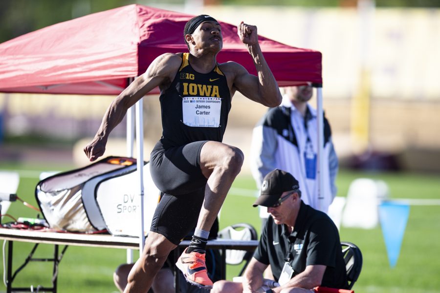 Iowa’s James Carter Jr. leaps in the men’s long jump during day two of the 2022 Big Ten Outdoor Track and Field Championships at the University of Minnesota Track and Field Stadium in Minneapolis on Saturday, May 14, 2022. Carter Jr. placed second overall after his best leap recorded  7.84-meters, about 25 feet and 9 inches.