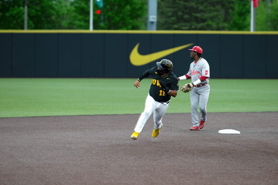 Iowa first basemen Izaya Fullard makes the turn at second base during a baseball game at Duane Banks Field in Iowa City on Friday, May 20, 2022. The Hawkeyes defeated the Hoosiers 12-0. Fullard had one hit and two walks.