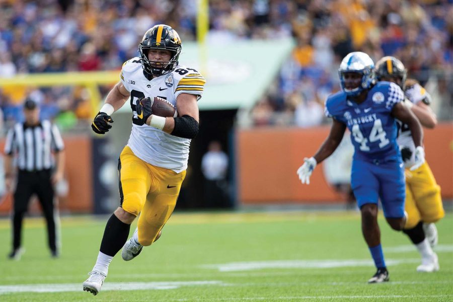 Iowa tight end Sam LaPorta runs the ball toward the end zone for a touchdown during the 2022 Vrbo Citrus Bowl between No. 15 Iowa and No. 22 Kentucky at Camping World Stadium in Orlando, Florida, on Saturday, Jan. 1, 2022. The Wildcats defeated the Hawkeyes, 20-17. 