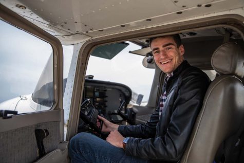 University of Iowa student Jack Sieleman poses for a portrait at the Iowa City Municipal Airport in Iowa City on Wednesday, April 27, 2022. Sieleman completed flight school at the Iowa City Municipal Airport in late 2020 and will head to Houston this June after accepting a position from NASA as a flight controller within the propulsion group.