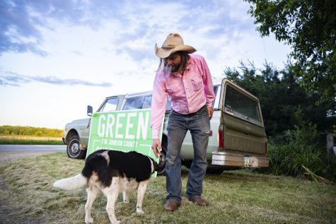 Jon Green, D-Iowa, pets his dog, Snoopy, during Greens watch party for the 2022 Iowa primaries in Lone Tree, Iowa, on Tuesday, June 7, 2022. Green won a primary race for the Johnson County Board of Supervisors after receiving 69 percent of the vote, the most between three candidates.