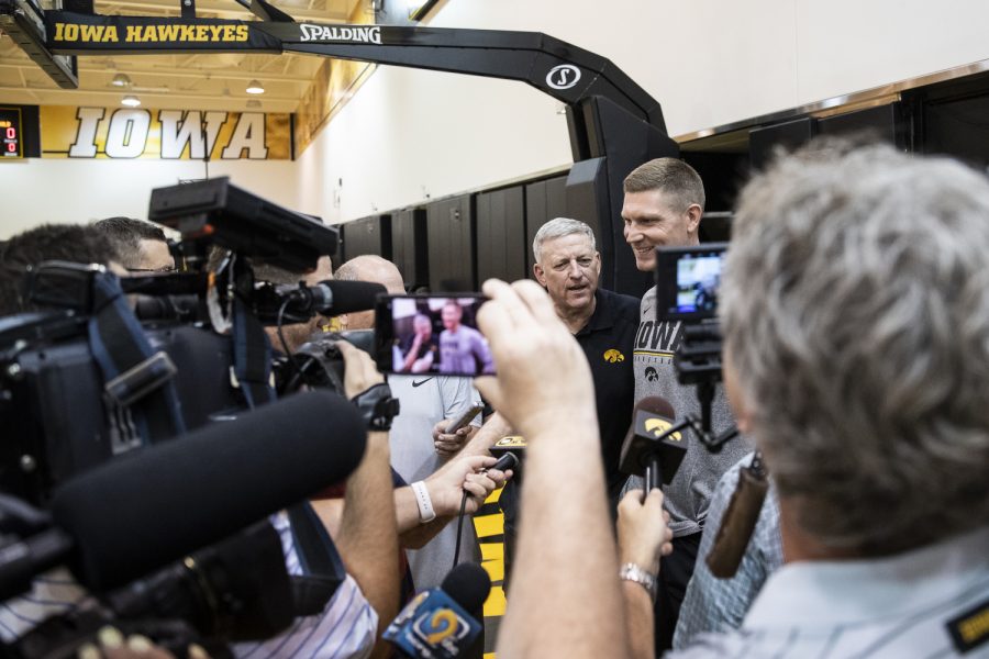 Former Iowa assistant coach Kirk Speraw jokes with newly introduced assistant coach Matt Gatens during an Iowa men’s basketball practice at Carver-Hawkeye Arena on Wednesday, June 15, 2022. Gatens filled the role Speraw’s retirement left open. During the interviews, reporters asked if Gatens would play a similar role to Speraw in working with shooters. “…naturally shooting is something that I kind of go to but I'm not gonna sit here and say I'm gonna try to replace whatever you know, Coach Speraw and what he did,” Gatens said. “But yeah, I like to enjoy helping guys get out there shooting. All parts of the game.” Gatens played collegiate basketball for the Hawkeyes and most recently coached for the Drake Bulldogs in Des Moines.