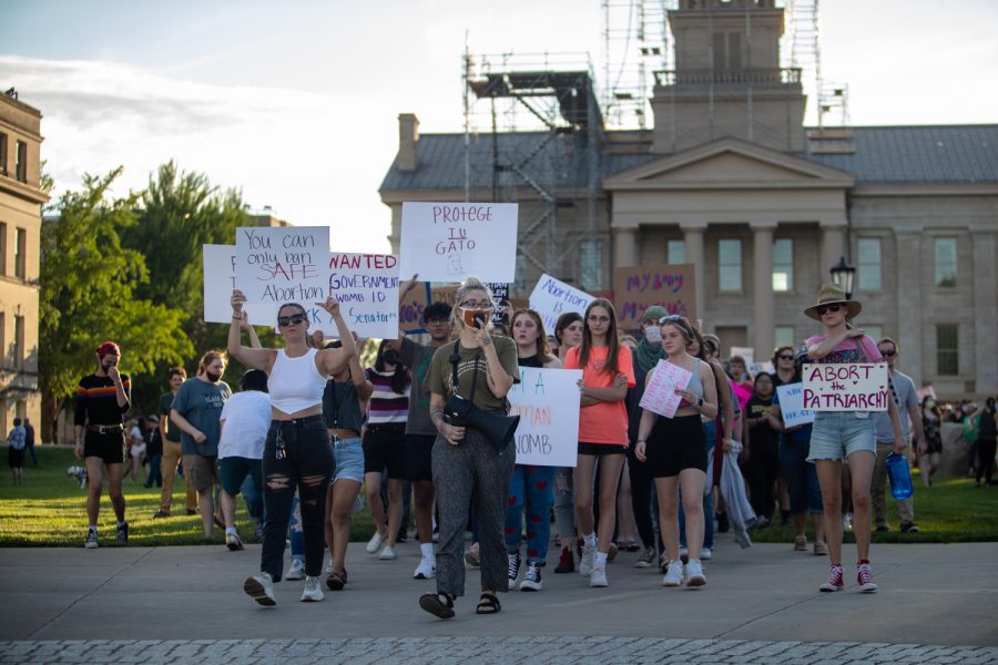 Protesters leave the University of Iowa Pentacrest to march at a pro-abortion rights protest on Friday, June 24, 2022. The march went down to College Green Park, down Burlington Street and through the Pedestrian Mall before ending at the Pentacrest.
