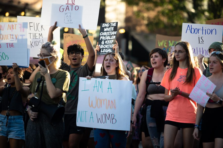 Protesters chant at a pro-abortion rights march through downtown Iowa City on Friday, June 24, 2022.