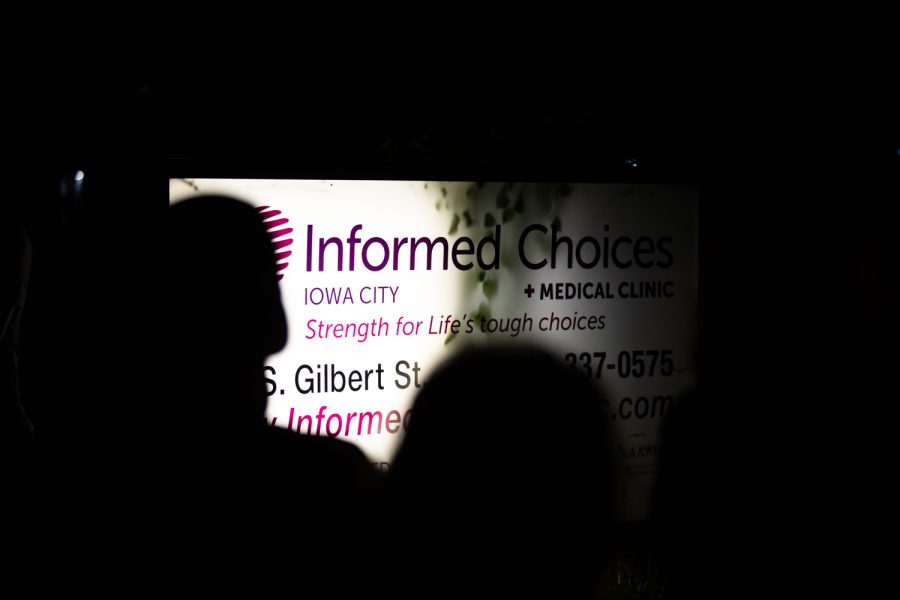 Protesters stand in front of Informed Choices, a medical clinic, during "Night of Rage," an abortion-rights protest, in Iowa City on Saturday, June 25, 2022. After several people spoke at the Pentacrest, the protesters marched through Iowa City.