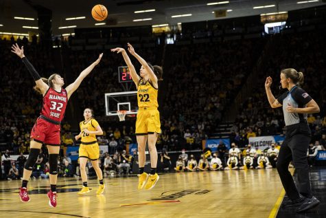 Iowa guard Caitlin Clark shoots a 3-pointer during a First Round NCAA women’s basketball tournament game against No. 2 Iowa and No. 15 Illinois State in sold-out Carver-Hawkeye Arena on Friday, March 18, 2022. The Hawkeyes defeated the Redbirds, 98-58.