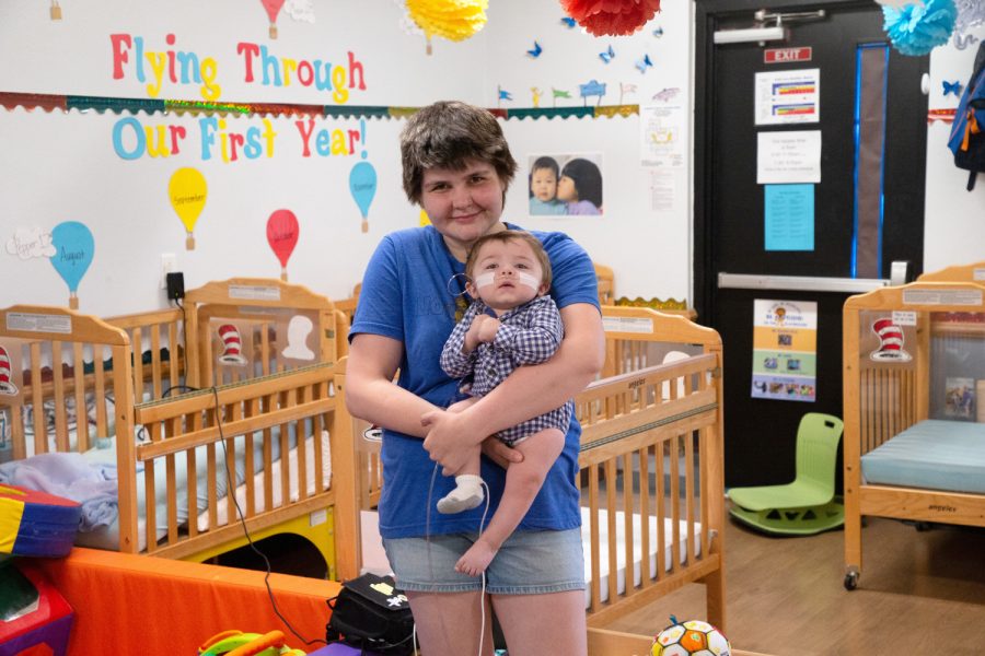 Iowa mom Alexandra Frost poses for a portrait with her son Mason at Lionheart Early Learning in Iowa City on Tuesday, June 14, 2022.