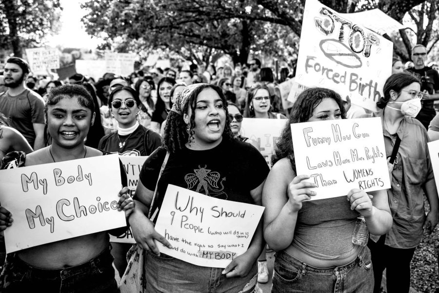 Abortion-rights protesters yell a chant during an abortion-rights protest in Des Moines following the U.S. Supreme Court’s decision to overturn Roe V. Wade on Friday, June 24, 2022. Protesters marched from Central Academy’s campus to Gov. Kim Reynolds' mansion on Terrace Hill.