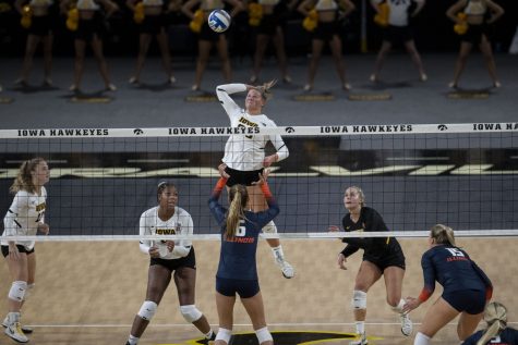 Iowa outside hitter Addie VanderWeide hits the ball during a volleyball game between Iowa and Illinois at Xtreme Arena in Coralville, Iowa, on Wednesday, Sept. 22, 2021. The Fighting Illini defeated the Hawkeyes with a score of 3-2.