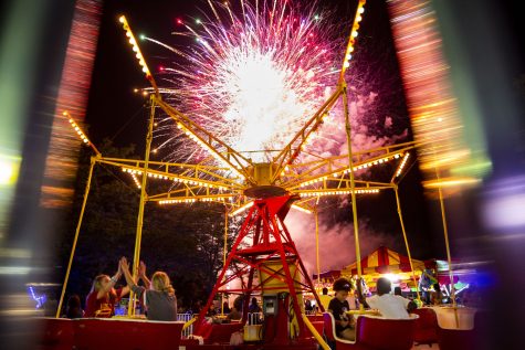 A firework shoots off over a ride at a carnival during 4thFest at S.T. Morrison Park in Coralville on Monday, July 4, 2022. The carnival featured food, games, and rides.