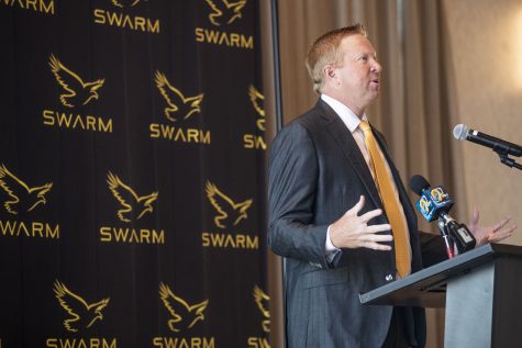 Iowa Swarm Collective President and CEO Brad Heinrichs speaks during a press conference for the Iowa Swarm Collective, a name, image, and likeness group partnering with Hawkeye student-athletes, at the Heights Rooftop in Iowa City on Tuesday, July 19, 2022. Heinrichs sees this NIL as an opportunity for students to profit on their name, image, and likeness. “These kids are going to learn how to market themselves,” Heinrichs said. “Thats the education I didnt get while I was in school.”