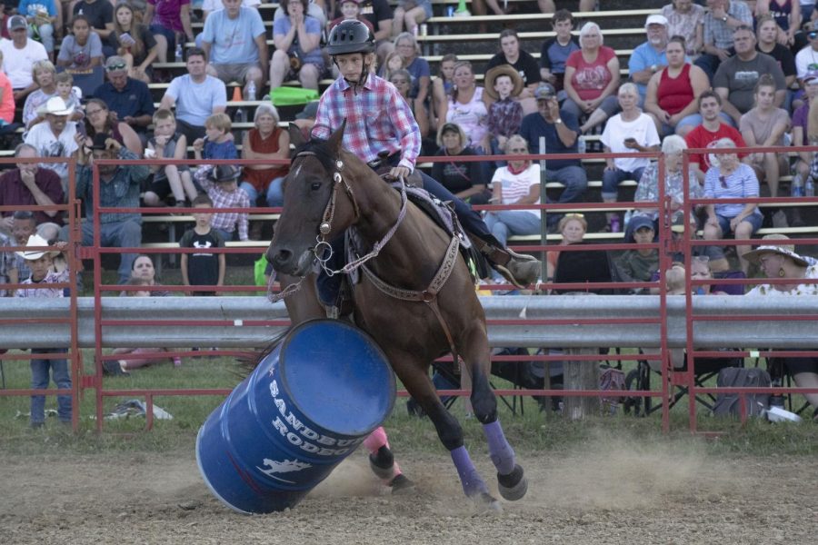 Kaylee Ryan hits a barrel during the Sandburr Family Youth Rodeo at the Johnson County Fairgrounds in Iowa City on Wednesday, July 27, 2022.