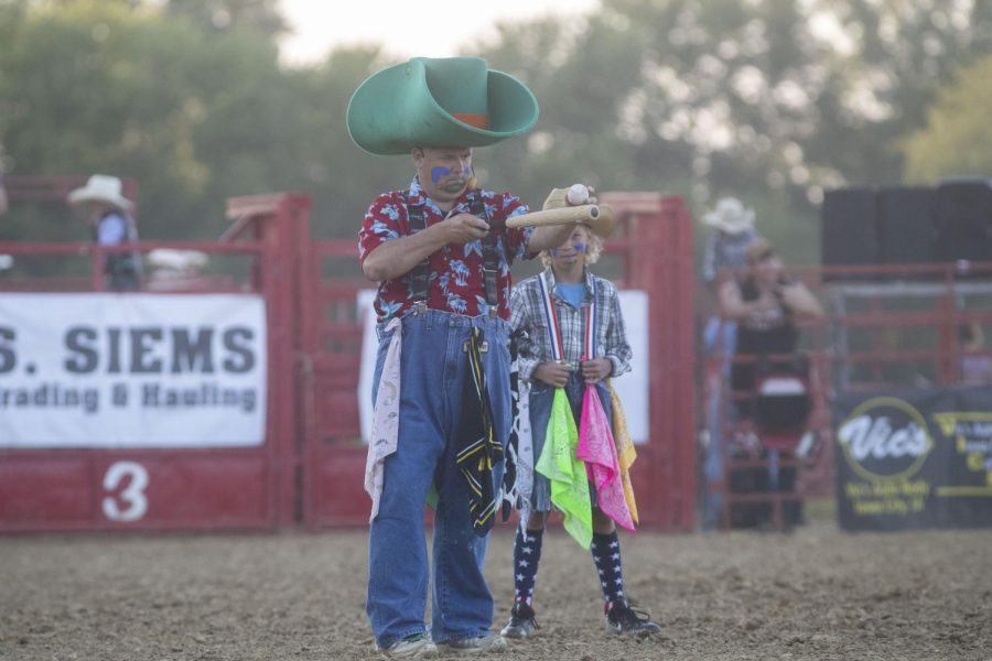 A Rodeo clown balances a ball on a bat during the Sandburr Family Youth Rodeo at the Johnson County Fairgrounds  in Iowa City on Wednesday, July 27, 2022.