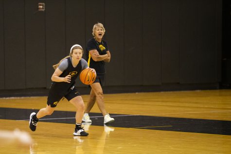 Iowa guard Molly Davis dribbles the ball during an Iowa women’s basketball media availability and open practice at Carver-Hawkeye Arena in Iowa City on Friday, July 29, 2022.