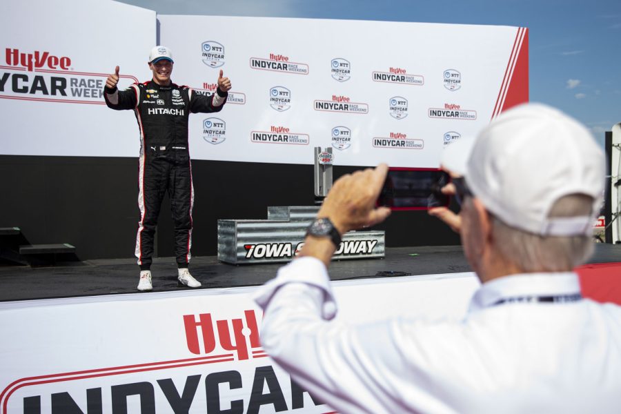 Roger Penske, owner of Team Penske, takes a picture of his driver, Josef Newgarden (2), after the NTT IndyCar Series HyVeeDeals.com 250 presented by DoorDash at Iowa Speedway in Newton, Iowa on Saturday, July 23, 2022. Newgarden finished first and his teammate Will Power (12), finished third.