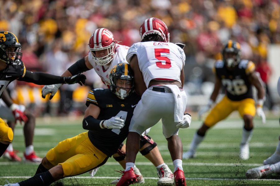 Iowa defensive back Dane Belton tackles Indiana running back Stephen Carr for a loss during a football game between No. 18 Iowa and No. 17 Indiana at Kinnick Stadium on Saturday, Sept. 4, 2021.