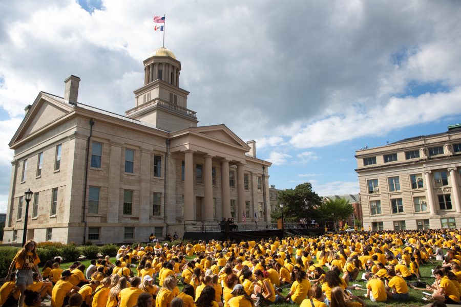 First-year students wait to listen to speeches during convocation at the University of Iowa’s Pentacrest on Sunday, Aug. 21, 2022.