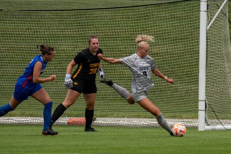 Iowa defender Samantha Cary kicking the ball across field to open teammate during a soccer game between Iowa and DePaul at the University of Iowa Soccer Complex on Sunday, Aug. 28, 2022. The Iowa Hawkeyes beat the DePaul Blue Demons, 4-0.