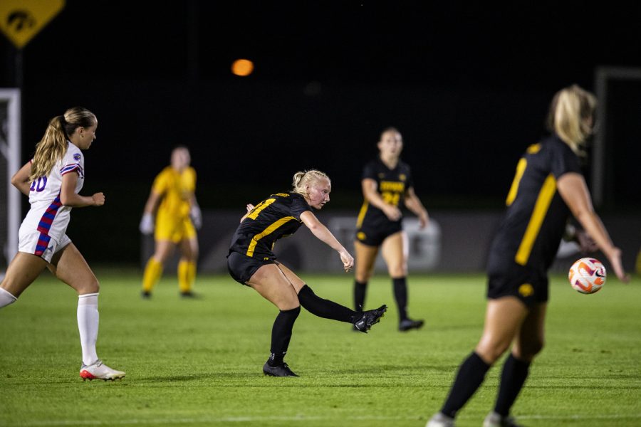 Iowa midfielder Kellen Fife passes the ball during a soccer game between Iowa and Kansas at the Iowa Soccer Complex in Iowa City on Thursday, Aug. 25, 2022. The Jayhawks defeated the Hawkeyes, 1-0. Fife played for 69 minutes and had one shot on target.