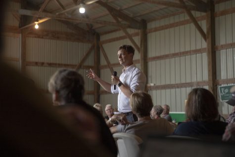 Iowa State Auditor Rob Sand speaks during the Kinney Summer BBQ Bash at the Kinney Family Farm in Oxford, Iowa on Saturday, Aug. 27, 2022. 
