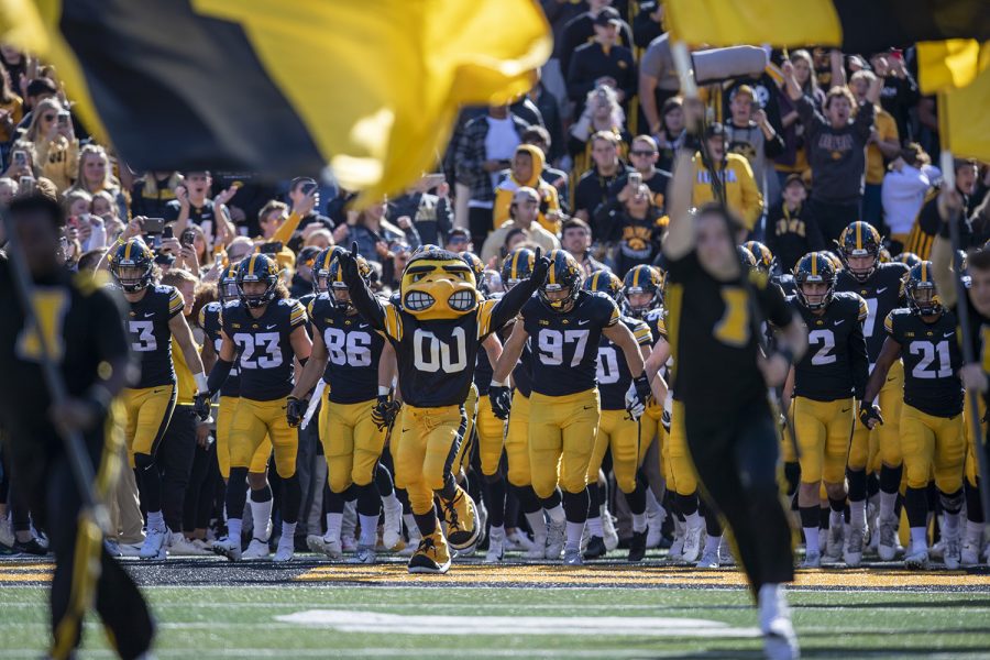 Herky leads the Hawkeyes to the field during a football game between Iowa and Purdue at Kinnick Stadium on Saturday, Oct. 16, 2021.