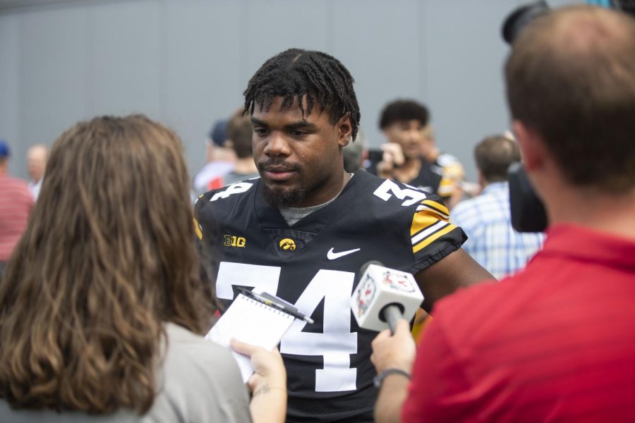 Iowa linebacker Jay Higgins interacts with the media during Hawkeye Football Media Day at the Iowa Football practice facility in Iowa City on Friday, Aug. 12, 2022