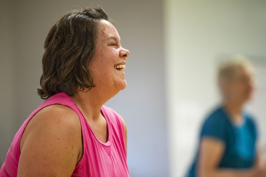 Attendee Jennifer Kohler smiles during a Dance Mixx class at Iowa City Jazzercise on Gilbert Street on Wednesday, Aug. 24, 2022. Kohler, who is sisters-in-law and best friends with Ruyle and Goodrich, started attending classes in November 2021, and really enjoys it. “It’s like therapy and a workout at the same time,” Kohler said.