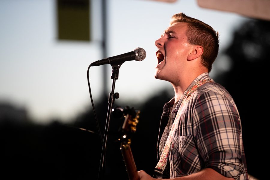 Soup RIOT!s Caleb Slater sings during Battle of the Bands at the Iowa Memorial Union Amphitheater on Wednesday, Aug. 31, 2022. Soup RIOT is a local punk rock band from Iowa City.