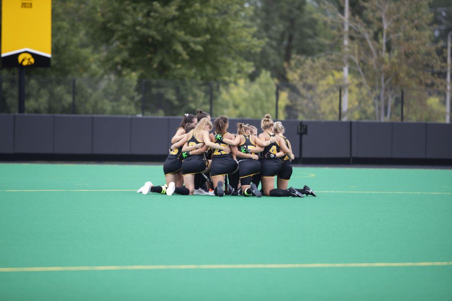 Iowa players huddle at midfield during a field hockey game between Iowa and St. Louis at Grant Field in Iowa City on Sunday, Sept.4, 2022. The Hawkeyes defeated the Billikens, 6-0.