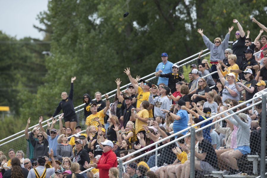 Fans attempt to catch a t-shirt during a field hockey game between Iowa and St. Louis at Grant Field in Iowa City on Sunday, Sept.4, 2022. The Hawkeyes defeated the Billikens, 6-0.