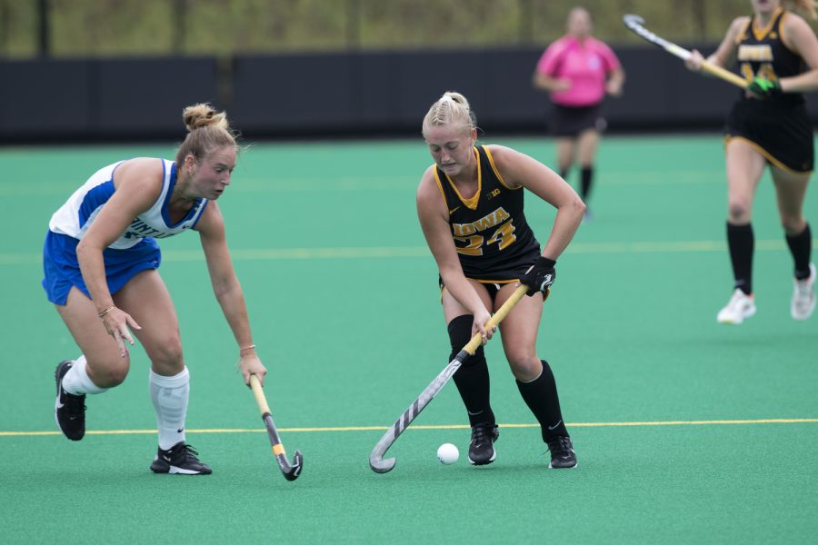 Iowa forward Annika Herbine moves the ball past a St. Louis defender during a field hockey game between Iowa and St. Louis at Grant Field in Iowa City on Sunday, Sept.4, 2022. The Hawkeyes defeated the Billikens, 6-0. Herbine recorded one goal and one assist.