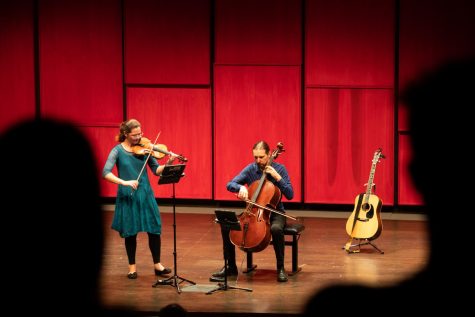 The Larksgrove Ensemble plays in the Voxman Recital Hall. EmmaLee Holmes-Hicks plays violin and Peter Say plays the cello and guitar. Sept. 8, 2022.