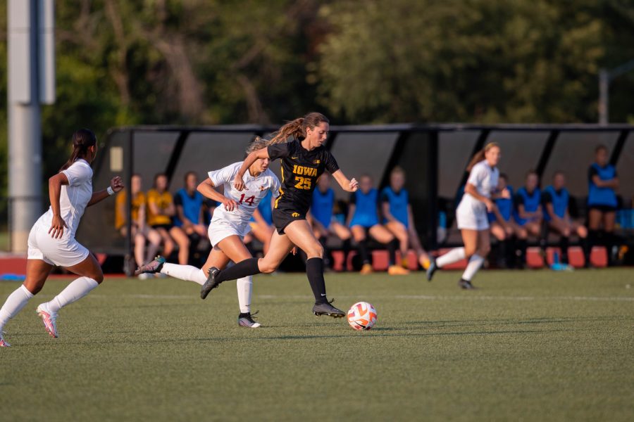 Iowa midfielder Josie Durr dribbles the ball downfield trailed by Iowa state midfielder Lauren Hernandez during a soccer game at the Cyclone Sports Complex in Ames, Iowa, on Thursday, Sept. 8, 2022. The Cyclones defeated the Hawkeyes, 2-1.