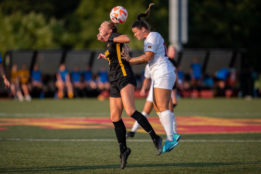 Iowa midfielder Hailey Rydberg hits the ball with her head as Iowa State midfielder Eva Steckelberg attempts to do the same during a soccer game at the Cyclone Sports Complex in Ames, Iowa, on Thursday, Sept. 8, 2022. The Cyclones defeated the Hawkeyes, 2-1.