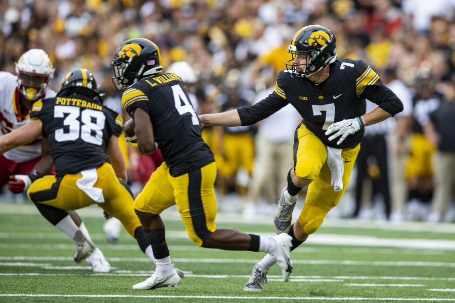 Iowa quarterback Spencer Petras hands off the ball to 	running back Leshon Williams during the Cy-Hawk football game between Iowa and Iowa State at Kinnick Stadium on Saturday, Sept. 10, 2022. The Cyclones ended a six-game Cy-Hawk series losing streak defeating Iowa, 10-7. Williams carried the ball 34 yards.