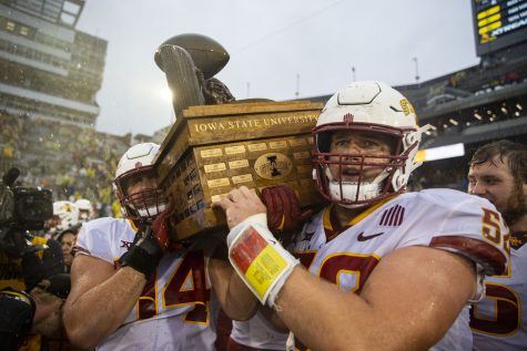 Iowa State linebacker Carson Willich and offensive lineman Trevor Downing hoists the Cy-Hawk Trophy after a football game between Iowa and Iowa State at Kinnick Stadium on Saturday, Sept. 10, 2022. The Cyclones ended a six-game Cy-Hawk series losing streak defeating Iowa, 10-7.
