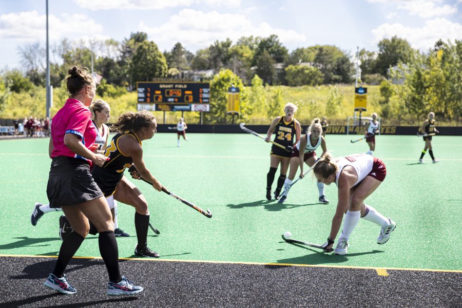 Iowa forward Harper Dunne pushes the ball toward the goal during a field hockey match between No. 6 Iowa and No. 22 Massachusetts at Grant Field in Iowa City on Sunday, Sept. 11, 2022. The Hawkeyes defeated the Minutewomen, 2-0.