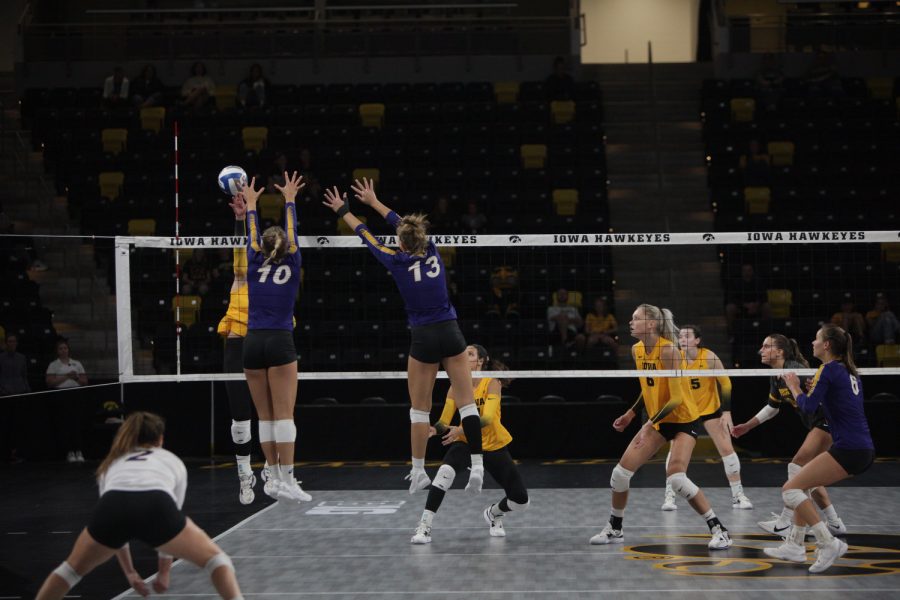 Northern Iowa outside hitter Emily Holterhaus and middle blocker Inga Rotto jump to block the ball during a volleyball match between Iowa and Northern Iowa at Xtream Arena in Coralville on Saturday, Sept. 17, 2022. Holterhaus had 13 kills and Rotto had one block. The Hawkeyes defeated the Panthers, 3-0.