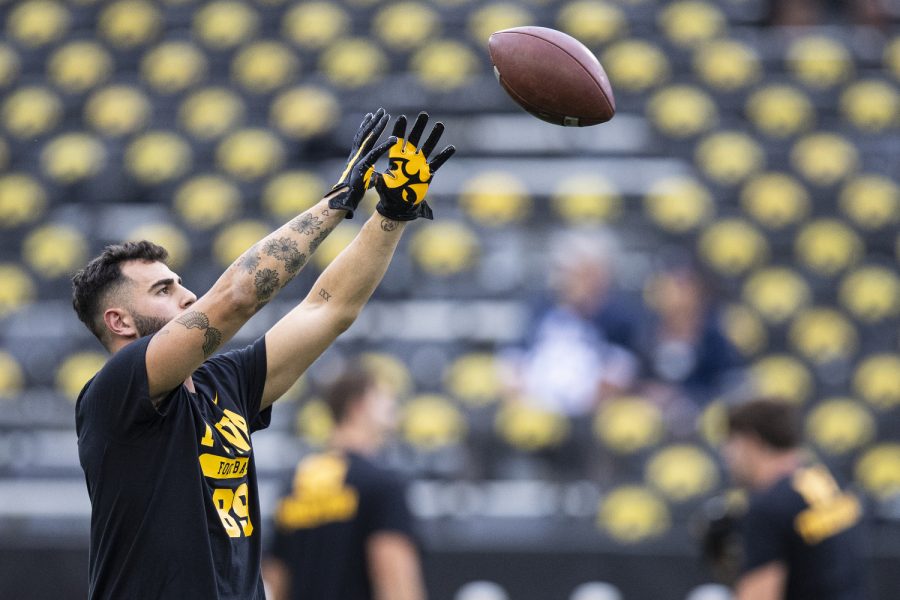 Iowa wide receiver Nico Ragaini catches a pass in warmups before a football game between Iowa and Nevada at Kinnick Stadium in Iowa City on Saturday, Sept. 17, 2022. Ragaini did not play in Iowa’s first two matchups this season. (Jerod Ringwald/The Daily Iowan)