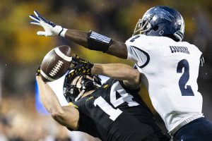 Iowa wide receiver Brody Brecht attempts to catch a pass while defended by Nevada defensive back Isaiah Essissima during a football game between Iowa and Nevada at Kinnick Stadium in Iowa City on Saturday, Sept. 17, 2022.