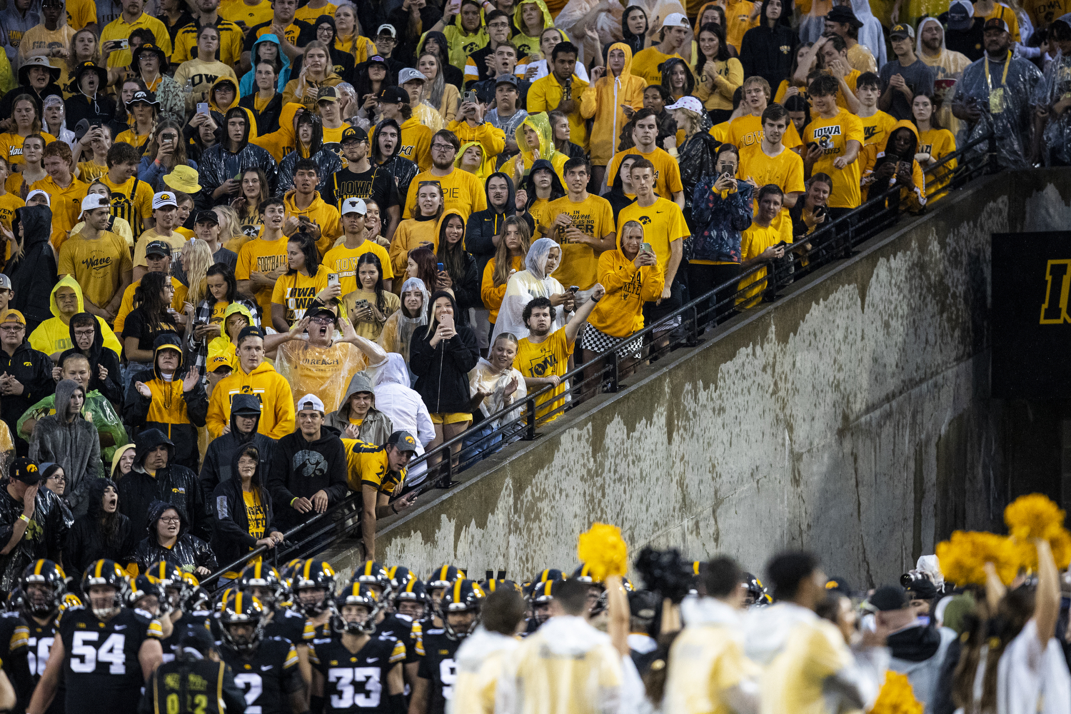 Dude crashes his parachute in a packed stadium of football fans