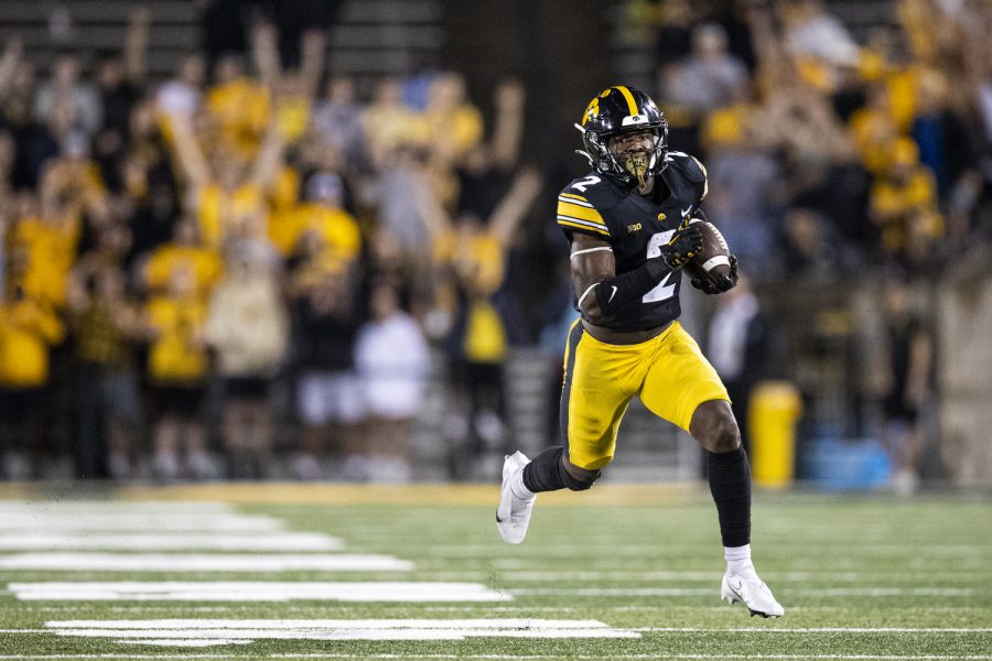 Iowa running back Caleb Johnson rushes the ball during a football game between Iowa and Nevada at Kinnick Stadium in Iowa City on Saturday, Sept. 18, 2022. Johnson scored a touchdown on the play. The Hawkeyes defeated the Wolfpack, 27-0.