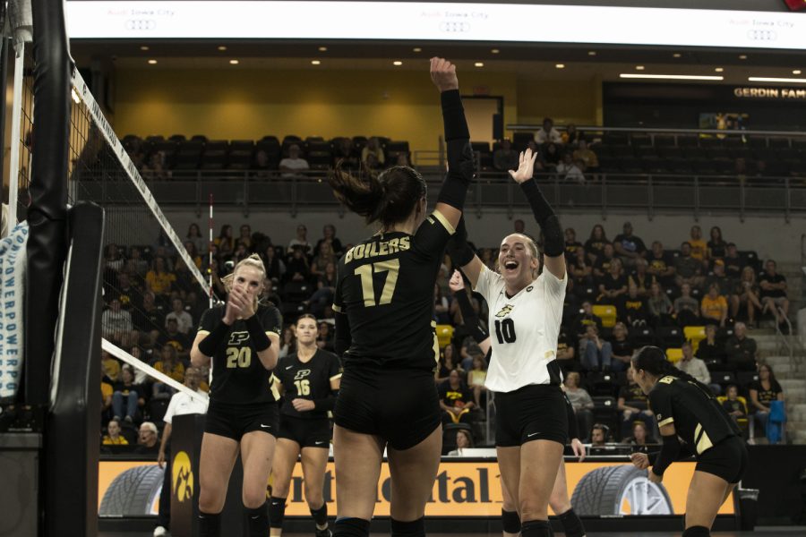 The Boilermakers cheer after winning a third set during a volleyball game between Iowa and Purdue at Xtream Arena in Coralville, Iowa, on Sunday, Sept. 25, 2022. The Boilermakers defeated the Hawkeyes 3-1.